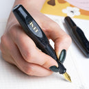 BENU Pixie Smoky Black Fountain Pen - A Hand Writing On Paper | EndlessPens