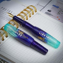 BENU Pixie Twilight Lagoon Fountain Pen - Two Pens On Top Of Notebook | EndlessPens