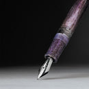 Leonardo Momento Magico Amethyst Fountain Pen (Stainless Steel) - Nib Exposed On Dark Background | EndlessPens