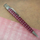 Retro 51 Tornado Vintage Metalsmith Harriet Tubman Rollerball Pen (On Wood and Pink Paper Background)