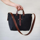 Peg and Awl Waxed Canvas Tote Bag - Coal - In The Hand Of A Person