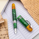 Conklin 1898 Spectra Fusion Green Fountain Pen - Pen and Cap Cover on Top of Notebook | EndlessPens