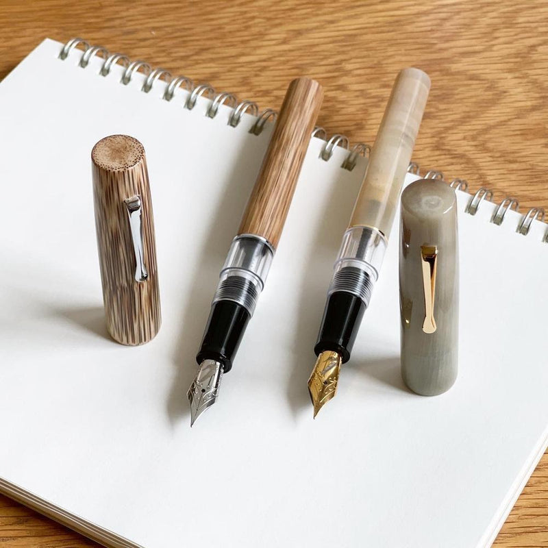 Fine Writing International Fountain Pen - Nyati an EndlessPens Online Pen Store Exclusive this 2021, compared to the Fine Writing International Fountain Pen - Mianzi EndlessPens 2021  Exclusive Fountain Pen.