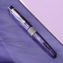 Kilk Celestial Chatoyant Purple Fountain Pen - Pen On Purple Background | EndlessPens