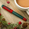 Opus 88 Omar Christmas Fountain Pen (2023) - On Top Of Table With Christmas Decorations