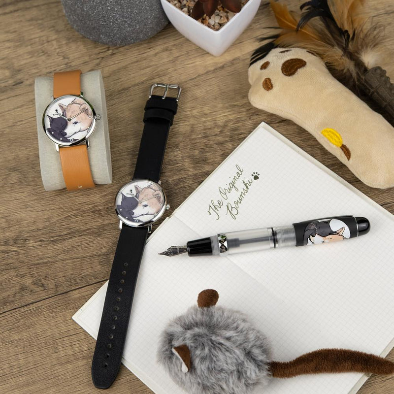 Opus 88 × BOUNSHI × @kimkanone_ The Original Bounshi Set - Pen, Wristwatch, Notebook, and Stuff Toys On Top Of Table | EndlessPens