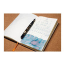 Pennonia Danuvius Danube Ink Bottle (60ml) - A Fountain Pen On Top Of A Notebook With An Ink Drawing