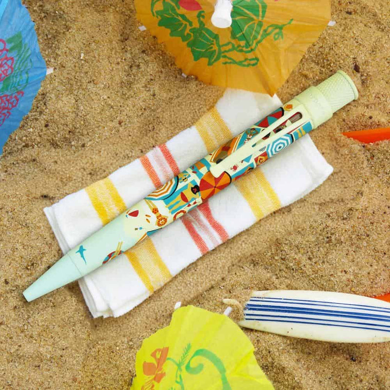 Retro 51 Tornado Popper Beachy Side-Up Rollerball Pen - Pen On Top Of Towel On Beach Sands Background | EndlessPens