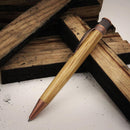 Retro 51 Tornado™ Woodworks Bourbon Barrel Rollerball Pen - Pen With Wood Planks On Background | EndlessPens