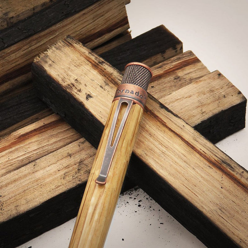 Retro 51 Tornado™ Woodworks Bourbon Barrel Rollerball Pen - Pen Close Up With Wood Planks On Background | EndlessPens