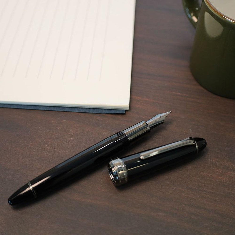 Sailor Naginata Togi Black Trim Fountain Pen - Pen With Cap Cover On Top of Table | EndlessPens