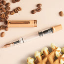 TWSBI ECO Caffe with Bronze Fountain Pen - Pen With Detached Cap Cover With Coffee Beans On White Background | EndlessPens