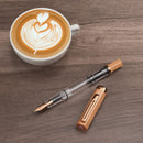 TWSBI ECO Caffe with Bronze Fountain Pen - Pen With Detached Cap Cover With A Cup Of Coffee On White Background | EndlessPens