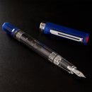 TWSBI ECO Dark Sapphire Fountain Pen - Pen With Detached Cap Cover On Black Surface | EndlessPens