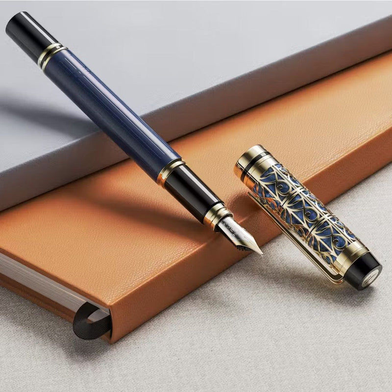 Waterman Man Blue de Paris Fountain Pen - Pen With Cap Removed Exposing Nib On Top Of Notebook | EndlessPens